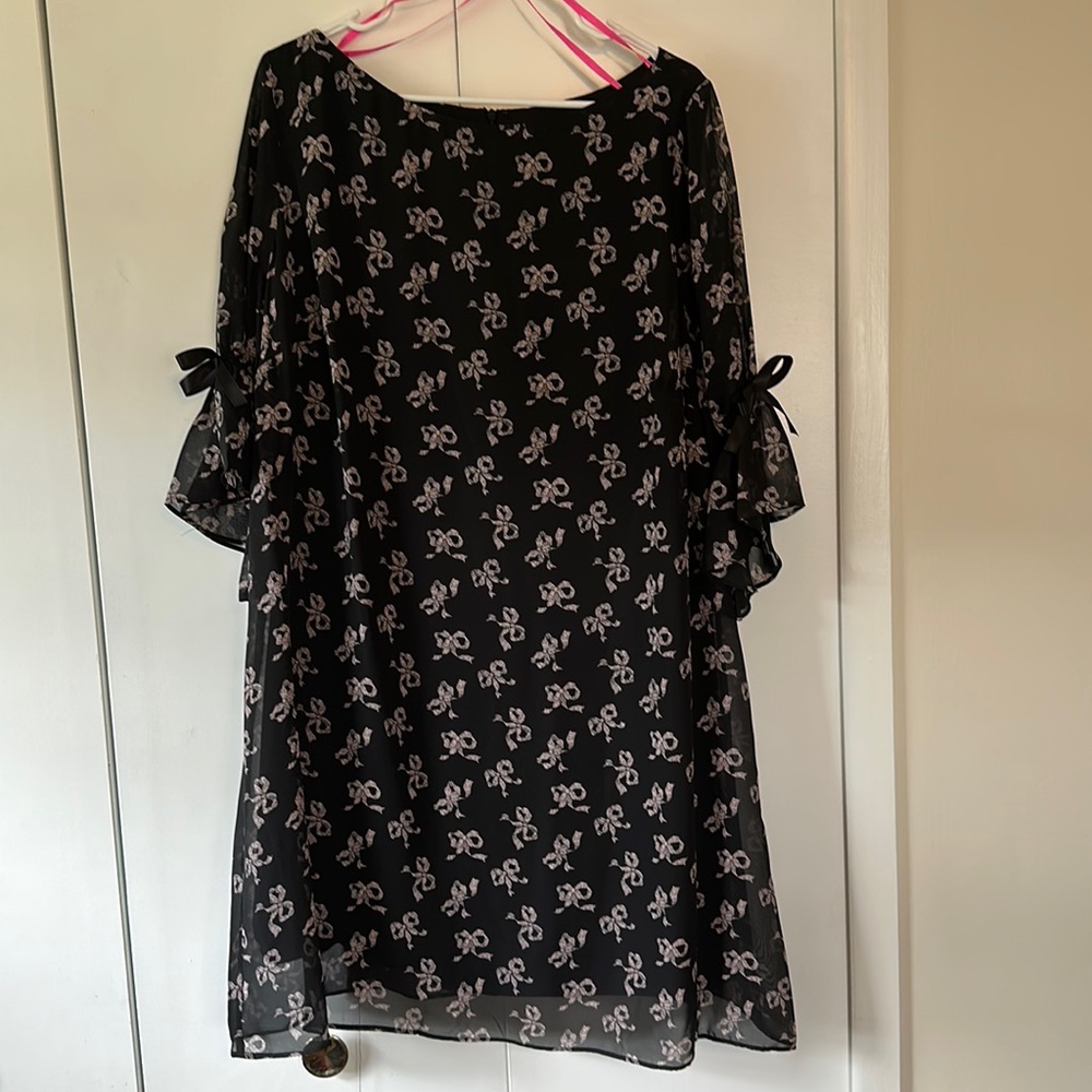 Betsey Johnson knee length black dress with light pink bows, bow detail on arms